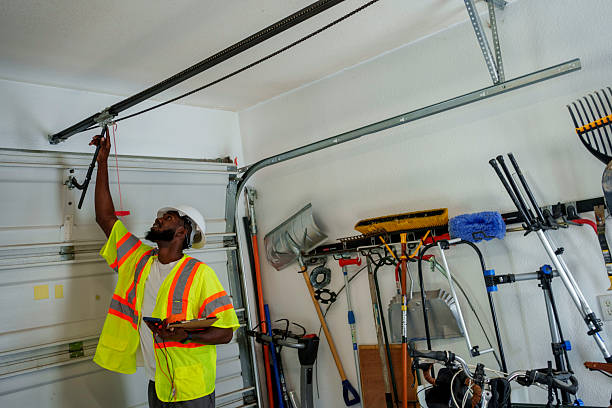 Professional Garage Door Panel Replacement technician working in Kinsley, KS